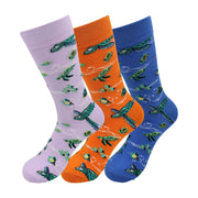 Orange crew socks with a playful pattern of sea turtles, fish, and bubbles.